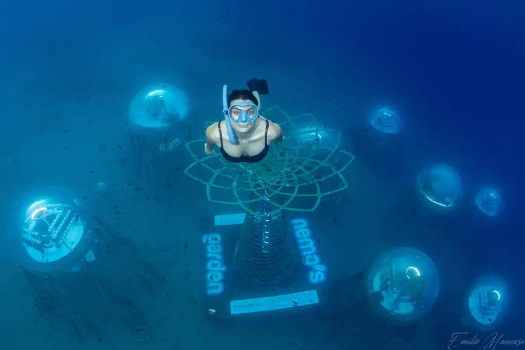 Woman practicing free diving at Nemo's Garden