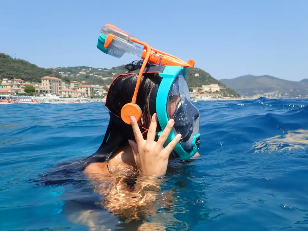 Woman in the sea with Aria Full Face Snorkeling Mask