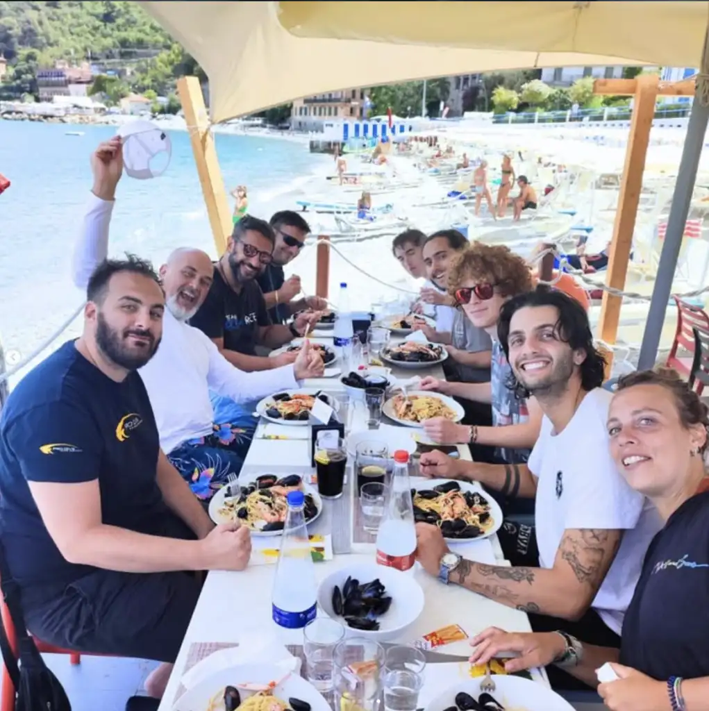 Divers having lunch together at Nemo's Garden beach